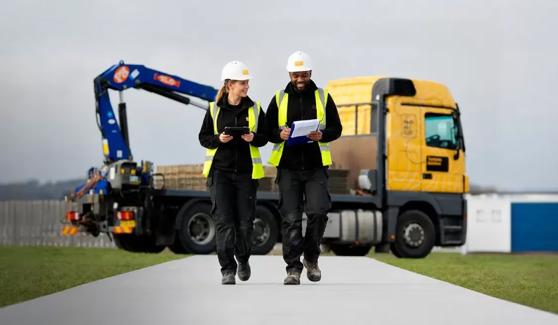 Trackway Solutions team beside a vehicle